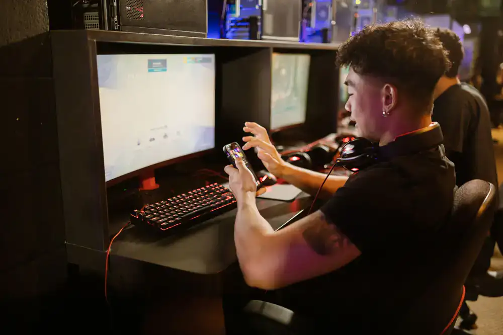 Developer testing mobile games on multiple phone devices