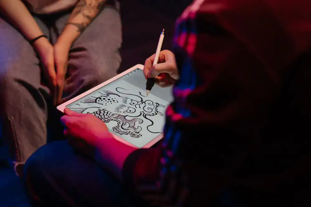Designers sketching game concepts on digital tablets